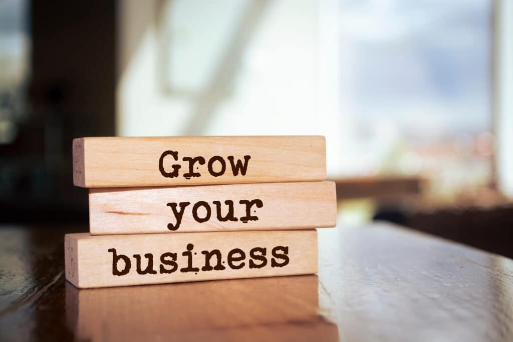 marketing tips - Wooden blocks with words 'GROW YOUR BUSINESS'. Business concept